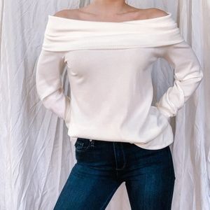 Off-the-shoulder white sweater
